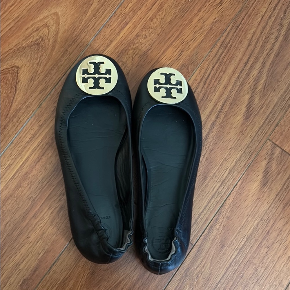 Tory Burch Black and Gold Flats with Signature Medallion